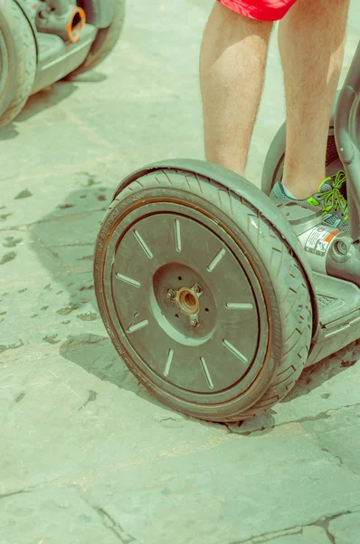FLORENCE, ITALY - JUNE 12, 2015: Hoverboard wheel stand on paviment, new transportation way on Italy — ストック写真