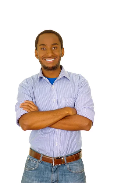 Bonito homem vestindo jeans e camisa azul claro em pé na frente da câmera sorrindo com os braços cruzados, fundo estúdio branco — Fotografia de Stock