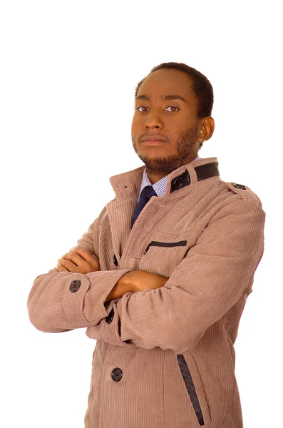 英俊的男人，穿着时尚光米色灯芯绒夹克站在摄像机双臂交叉，白色工作室背景 — 图库照片