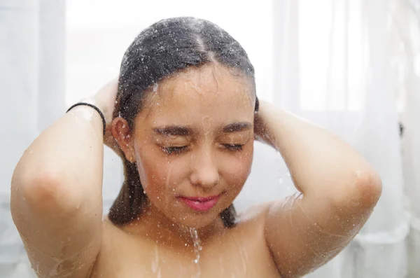 Headshot young woman showering — Stock Photo, Image