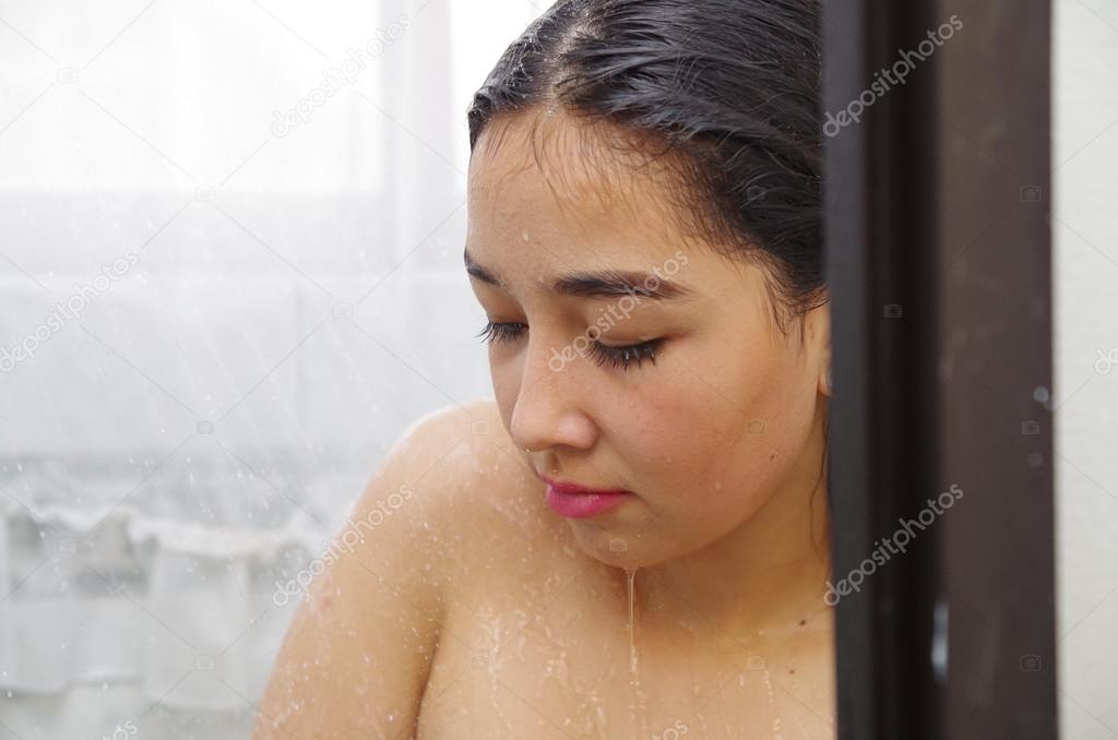 headshot young woman showering