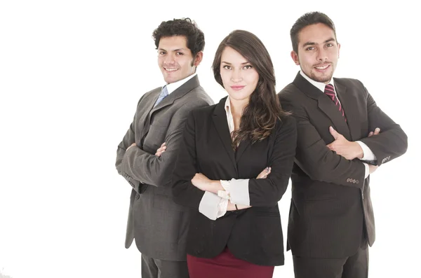 Dois empresários latinos e uma mulher de negócios em ternos posando — Fotografia de Stock