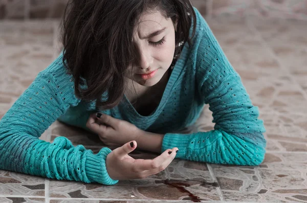 Pretty young girl with a bleeding nose after falling down — Stock Photo, Image