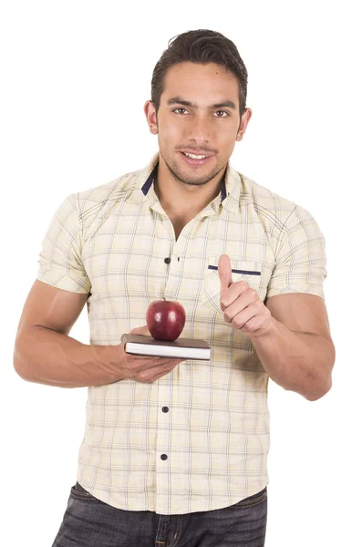 Jeune professeur masculin hapy tenant un cahier et pomme rouge — Photo