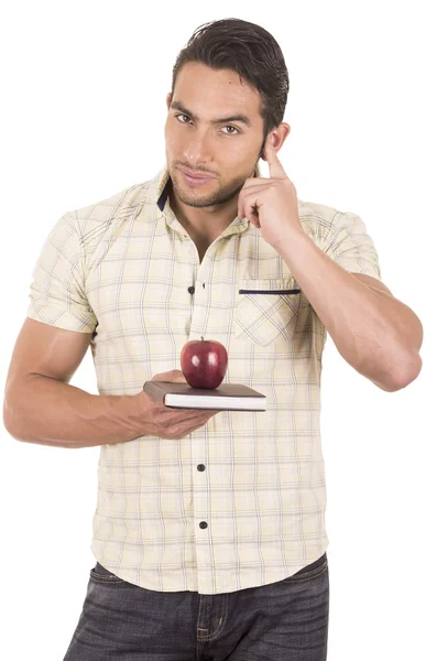 Jeune hispanique mâle enseignant tenant pomme rouge — Photo