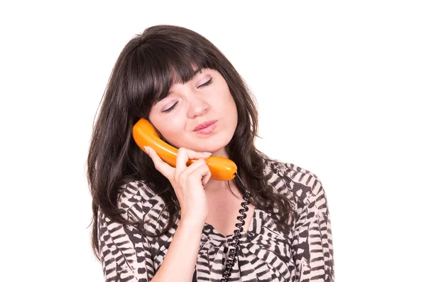 Krásná mladá žena retro oranžové telefon — Stock fotografie