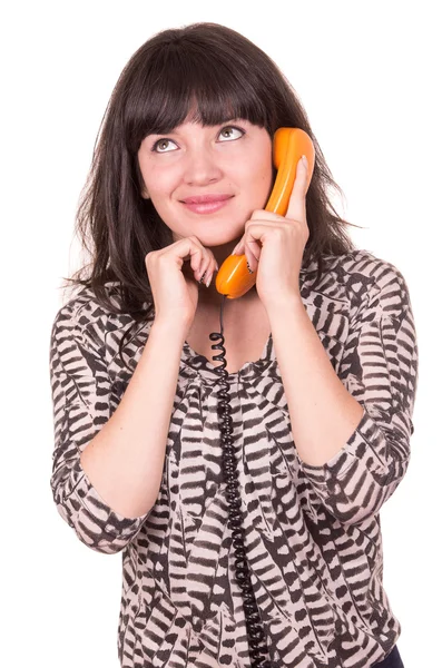 Schöne junge Frau mit orangefarbenem Retro-Telefon — Stockfoto