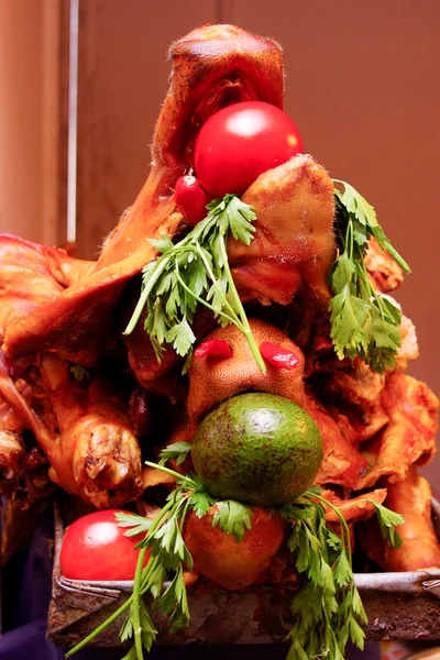 Roasted and crispy pig, avocato and tomatoe inside the mouth. Different form to show the food — Stock Photo, Image