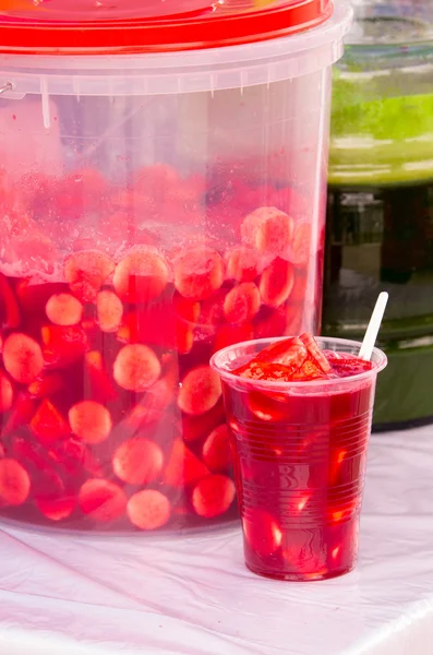 Fruits and juice ready to serve, bananas on plastic container. Sample in plastic glass — Stock Photo, Image