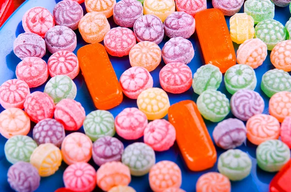 Closeup variation of colorful hard candy lying mixed as seen from above — Stock Photo, Image