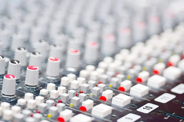 Closeup mixing faders and knobs as seen from above side angle, artistic studio equipment concept — Stock Photo, Image