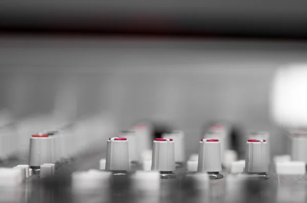 Closeup mixing faders and knobs as seen from above side angle, artistic studio equipment concept — Stock Photo, Image