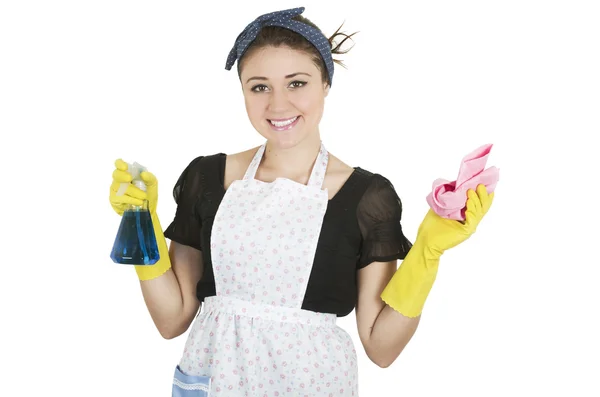Menina jovem vestindo avental e segurando produtos de limpeza — Fotografia de Stock