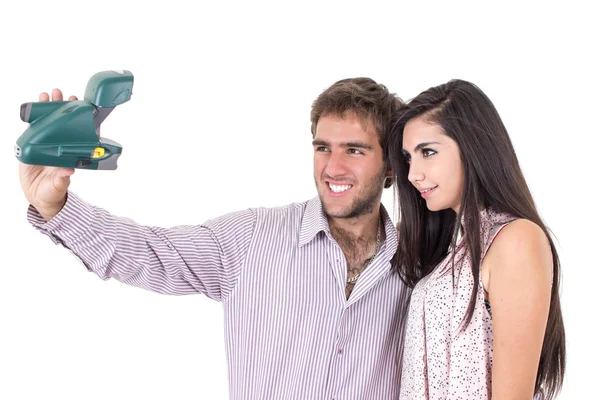 Cute couple taking photos with instant old camera — Stock Photo, Image