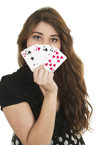 Hezká brunetka mladá dívka drží balíček karet — Stock fotografie