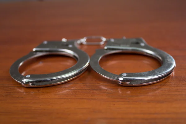 Closeup shot of metallic handcuffs — Stock Photo, Image