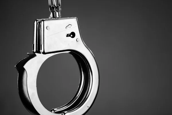 Closeup shot of metallic handcuffs — Stock Photo, Image