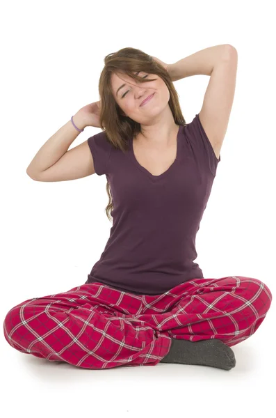 Pretty brunette teenage girl in pajamas pyjamas waking up — Stock Photo, Image