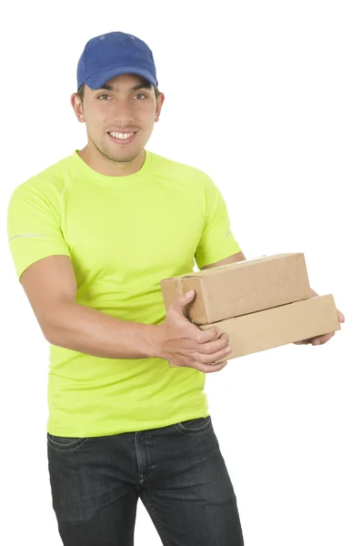 Handsome friendly brunette delivery man carrying boxes — Stock Photo, Image