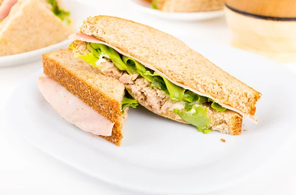 Ham and lettuce sandwich on a white plate — Stock Photo, Image