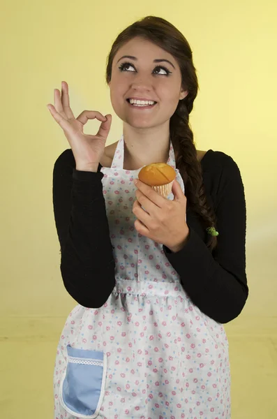 Happy pretty young girl wearing cooking apron