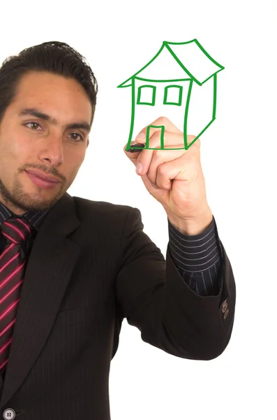 Young handsome businessman drawing on whiteboard with marker — Stock Photo, Image