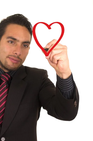 Jonge knappe zakenman tekenen op het whiteboard met marker — Stockfoto