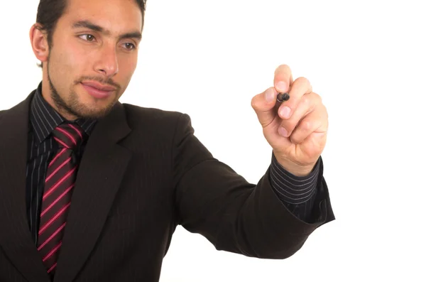 Joven hombre de negocios guapo escribiendo en pizarra blanca con marcador — Foto de Stock