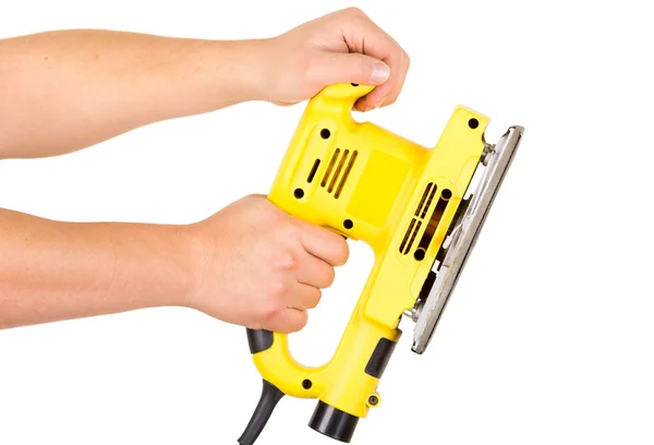 Hands holding an electrical sander — Stock Photo, Image