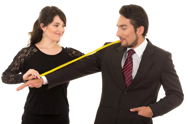 Young woman tailor designer taking measures of client — Stock Photo, Image