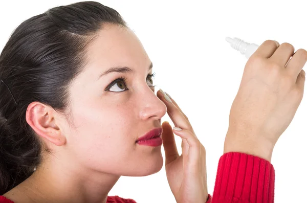 Beautiful young woman holding eye drop bottle — Stock Photo, Image