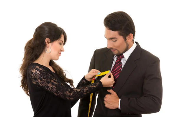 Joven mujer sastre diseñador tomando medidas de cliente —  Fotos de Stock