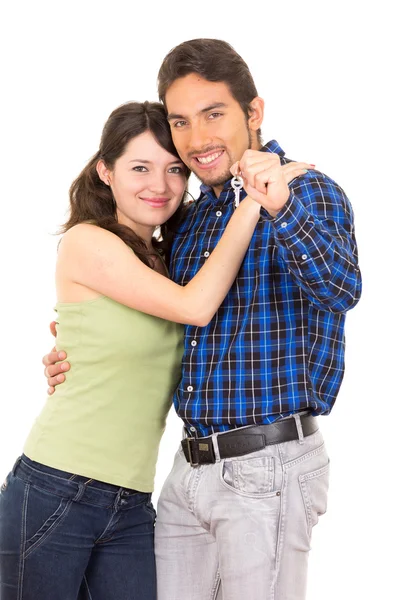 Cute young couple happy hugging holding key — Stock Photo, Image