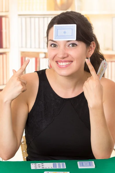 Young beautiful girl playing cards — Stock Photo, Image