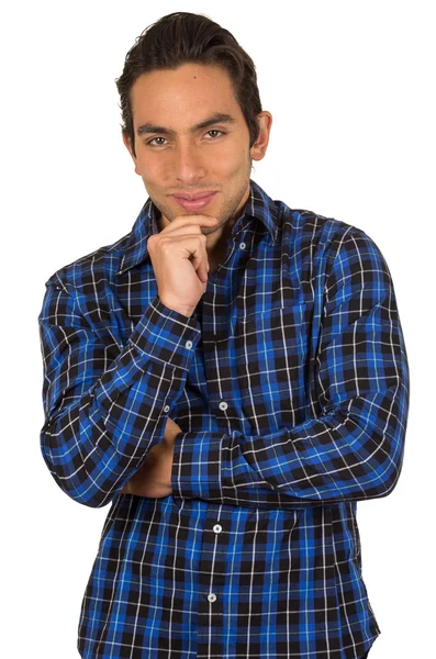 Guapo joven latino usando una camisa a cuadros azul posando — Foto de Stock