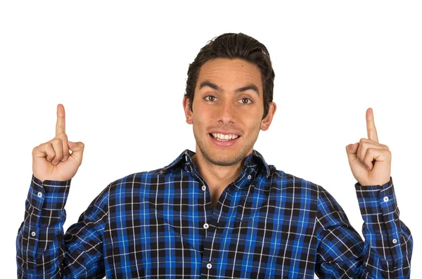 Handsome young latin man wearing a blue plaid shirt posing — Stock Photo, Image