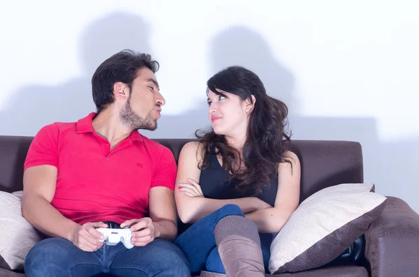 Girlfriend waiting for boyfriend to stop playing video games — Stock Photo, Image