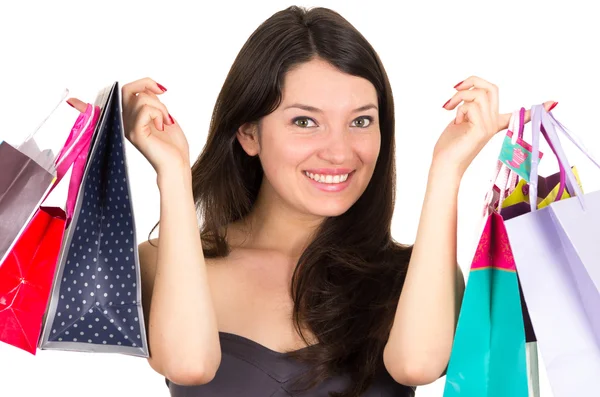 Hermosa joven morena sonriente mujer compras celebración bolsas —  Fotos de Stock