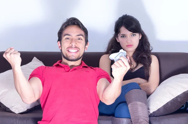 Girlfriend waiting for boyfriend to stop playing video games — Stock Photo, Image