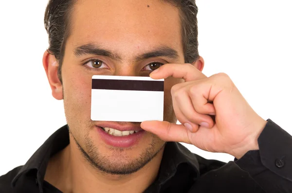 Closeup portrait of handsome young man holding credit card — Stock Photo, Image