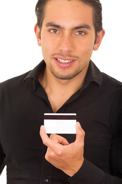 Closeup portrait of handsome young man holding credit card Royalty Free Stock Photos