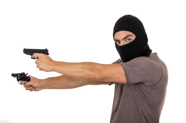 男性泥棒マスクを身に着けていると分離された銃を保持しています。 — ストック写真