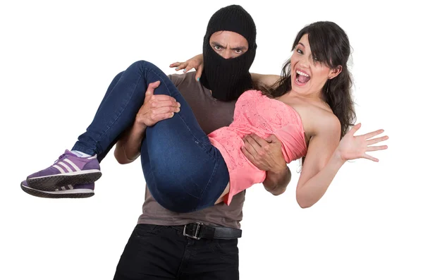 Male thief kidnapping carrying young girl — Stock Photo, Image