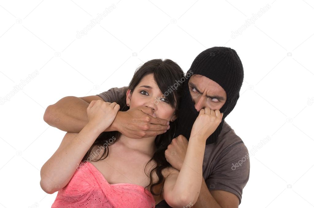 male angry thief kidnapping holding young girl