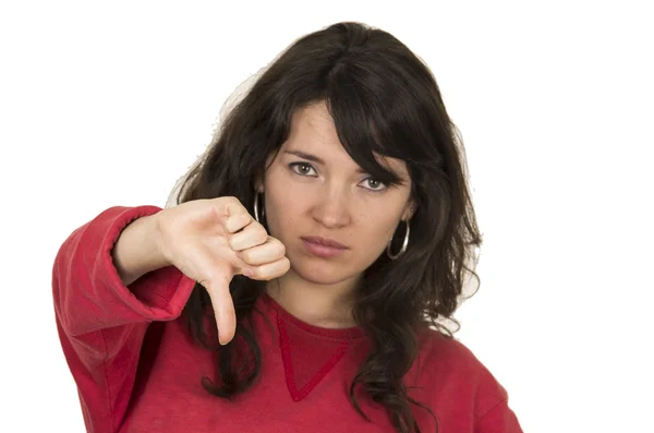 Pretty young girl wearing red top posing with thumb down — Stock Photo, Image