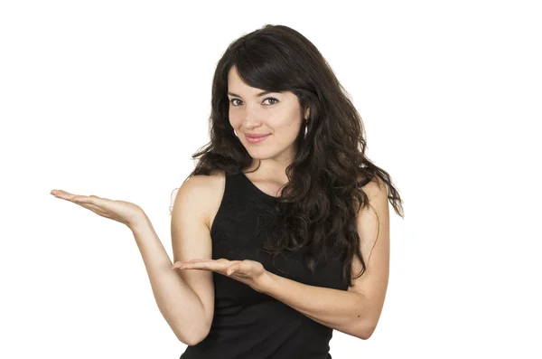 Mooie jonge brunette vrouw dragen zwarte top poseren presenteren met handen — Stockfoto