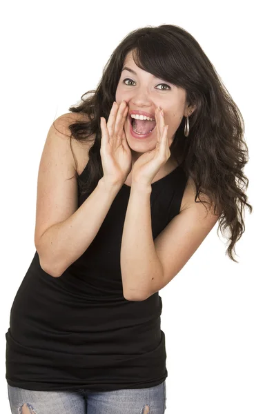 Beautiful young brunette woman wearing black top posing screaming — Stock Photo, Image