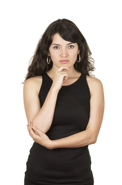 Beautiful young brunette woman wearing black top posing with hand on chin thinking — Stock Photo, Image