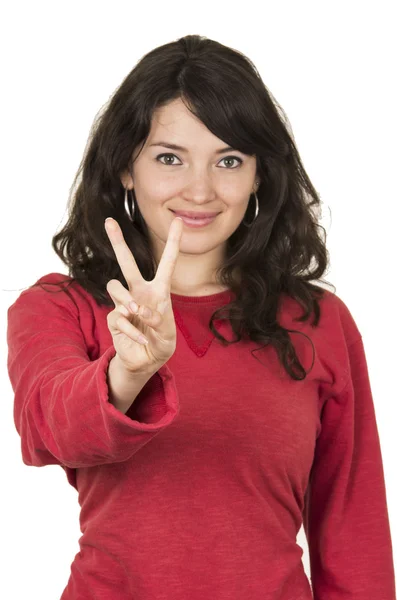 Pretty young girl wearing red top posing gesturing peace sign — Stock Photo, Image