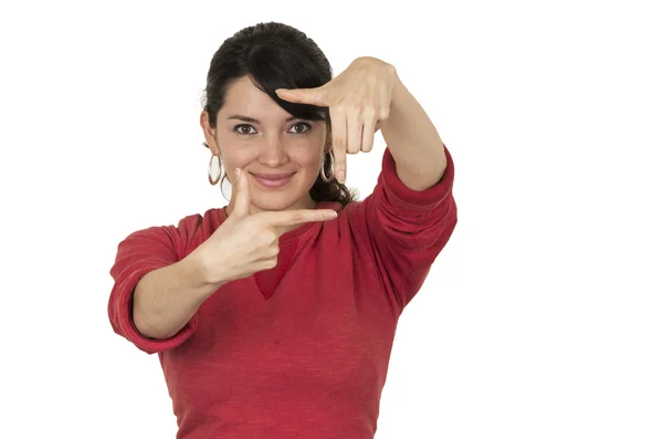 Pretty young girl wearing red top posing making frame with hands — Stock Photo, Image